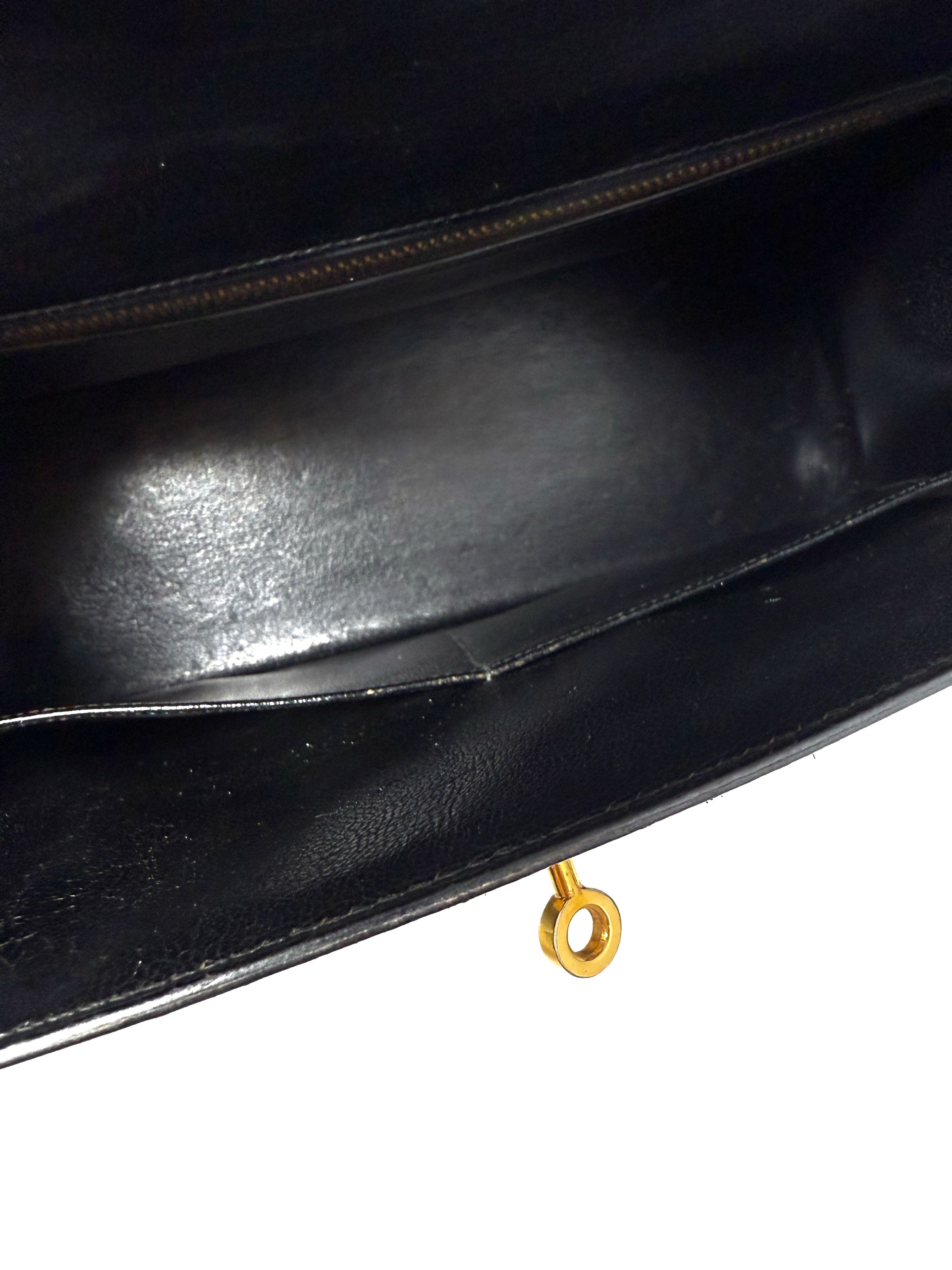 Interior of Kelly 32 with black leather lining and slip pockets