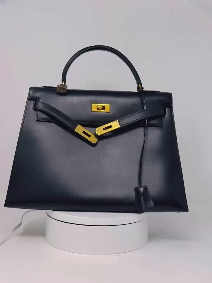 Video of Hermes Kelly 32 Black Box Sellier bag (1985) in black Box Calf leather with gold hardware