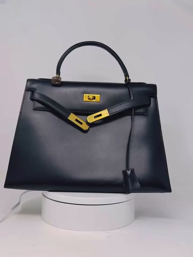 Video of Hermes Kelly 32 Black Box Sellier bag (1985) in black Box Calf leather with gold hardware
