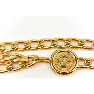 chanel chain belt in gold with CC logo and medallion.
